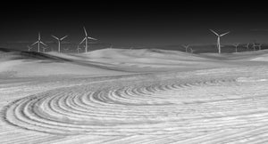 Wind Turbines On Snowy Wheat Field
