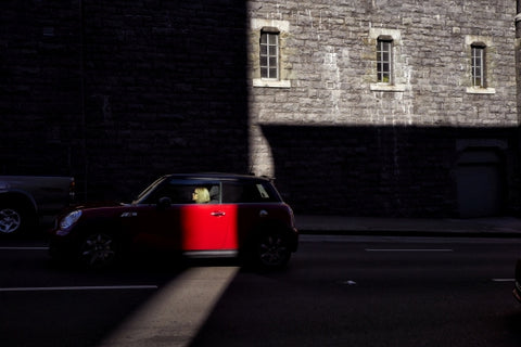 Lady Driving A Red Mini